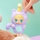 POP MART Baby Molly Pocket Friends Series in a purple outfit with a yellow hat held by a hand against a light green background
