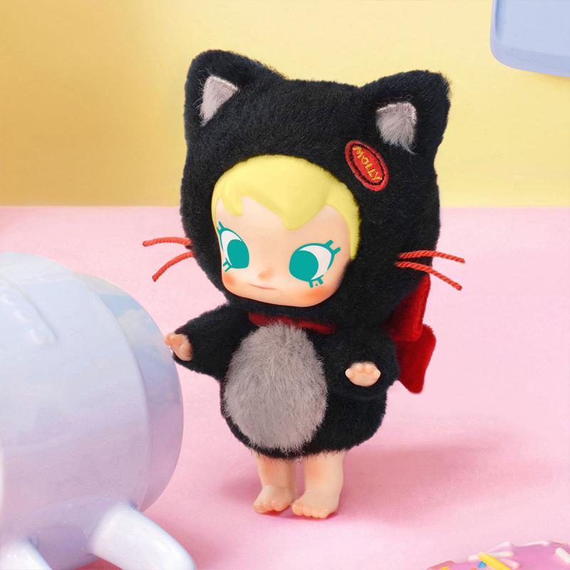POP MART Baby Molly Pocket Friends Series with cat-like design on a pink surface with a yellow background