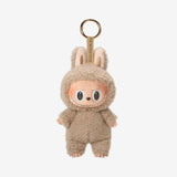 POP MART Labubu The Monsters keychain in a beige costume on a white background