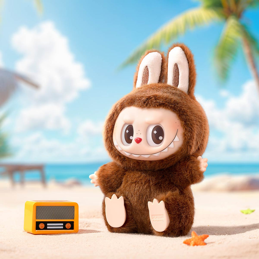 Pop Mart Labubu in a brown costume with bunny ears on a beach with palm trees and blue sky.