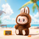 Pop Mart Labubu in a brown costume with bunny ears on a beach with palm trees and blue sky.