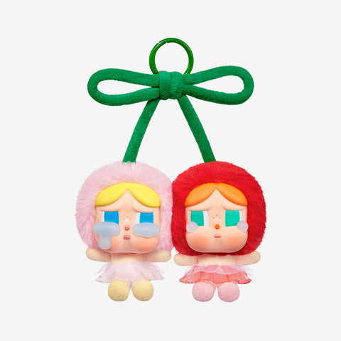 Pop Mart Labubu with green hair ties on a white background