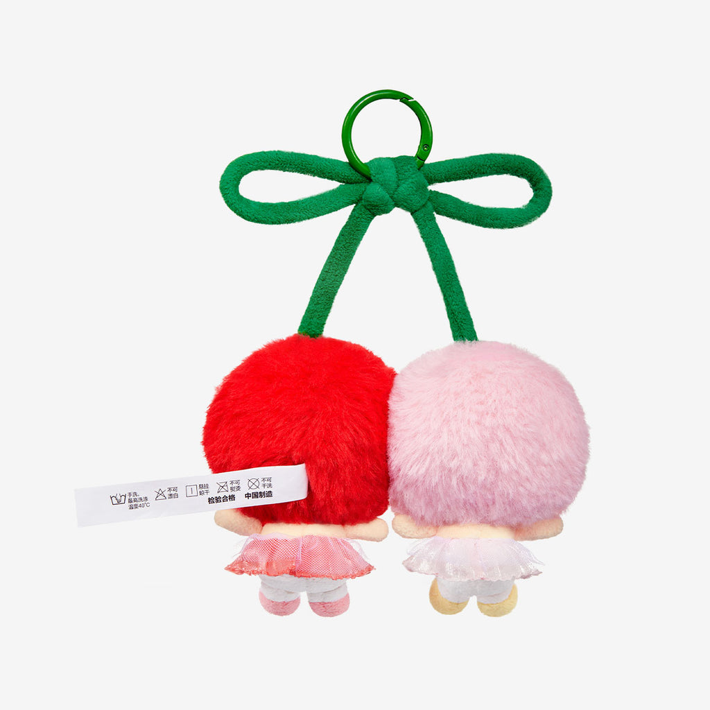 Back view of two Pop Mart Labubu with a green ribbon on a white background