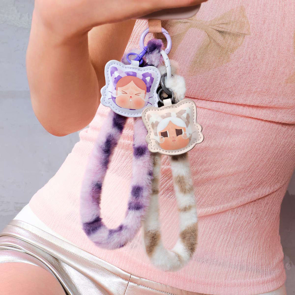 Plush keychain with Pop Mart Labubu attached to a pink bag