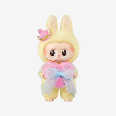 Monsters Labubu with bunny ears and a heart-shaped outfit on a white background