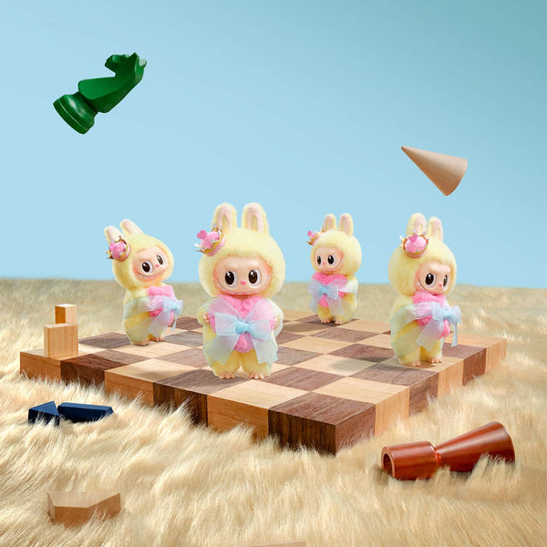 Four Monsters Labubu on a chessboard with game pieces floating around, set against a blue sky.