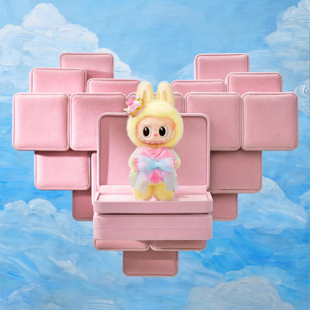 Monsters Labubu in a pink geometric structure with a blue cloud background