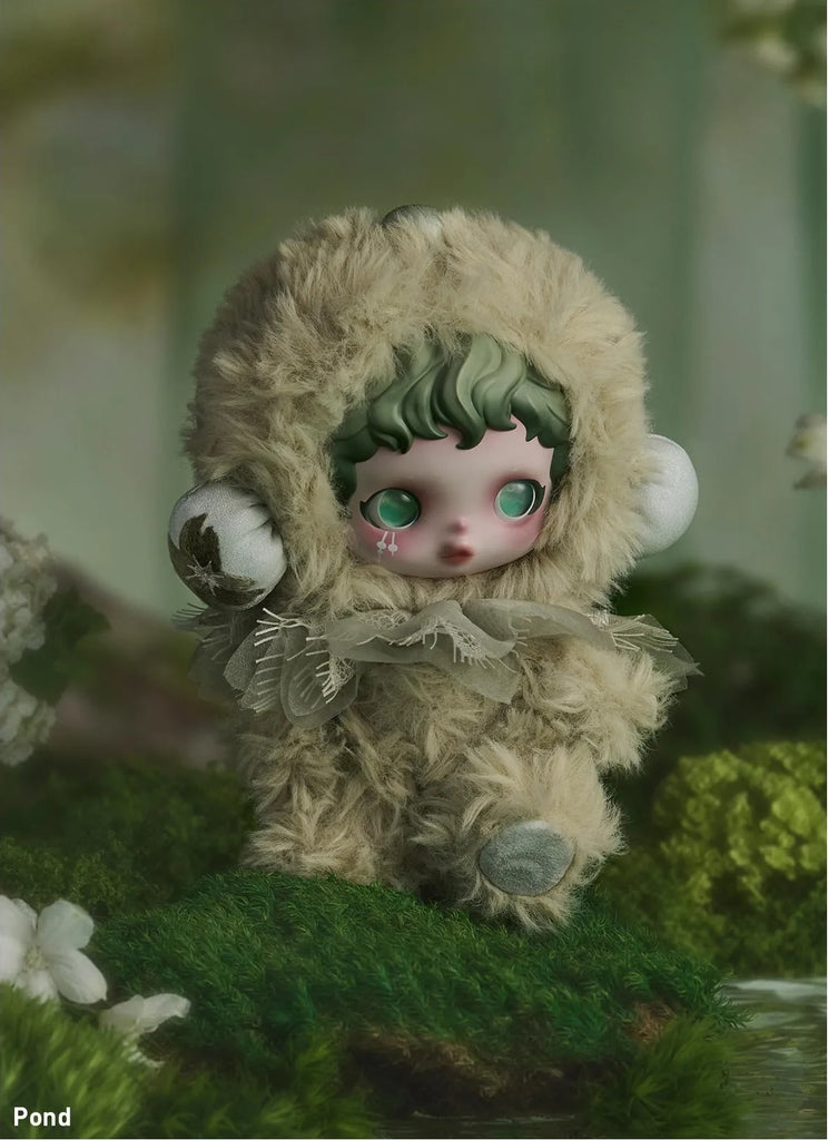 POP MART’s Skullpanda in a fluffy costume sitting on a green surface with a blurred background