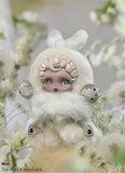 Stylized POP MART’s Skullpanda with white fur and bunny ears surrounded by flowers