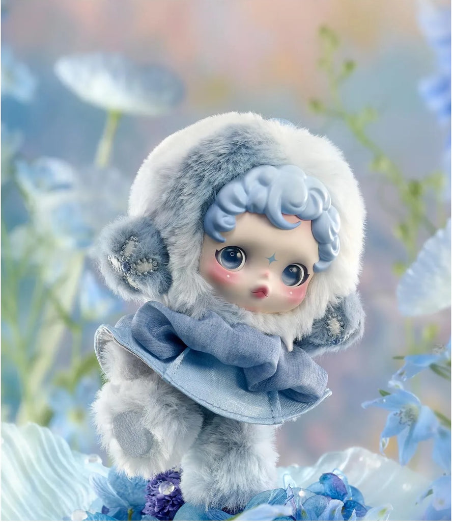 POP MART’s Skullpanda in a winter outfit with a blurred floral background