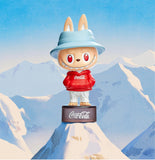POP MART Labubu Coca cola Series wearing a Coca-Cola hoodie with a mountainous background