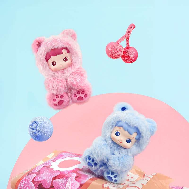 Two POPMART HACIPUPU Gummy Bear Series, one pink and one blue, on a pink surface with a light blue background.
