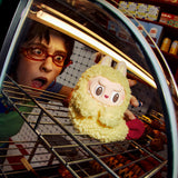 Person holding a POPMART the MONSTERS Wacky Mart Series Earphone Case inside an oven with a surprised expression.