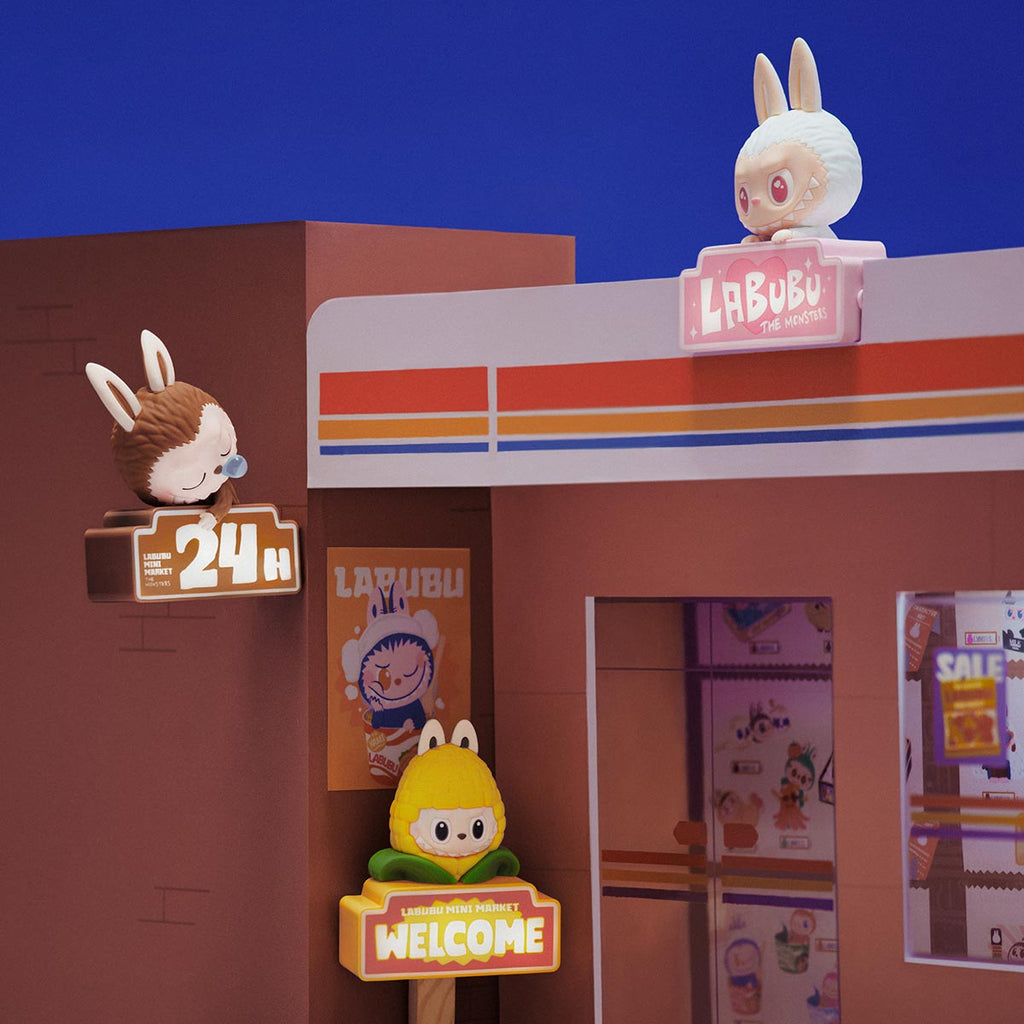 Toy store display with Pop Mart the Labubu Monsters and signage against a blue background