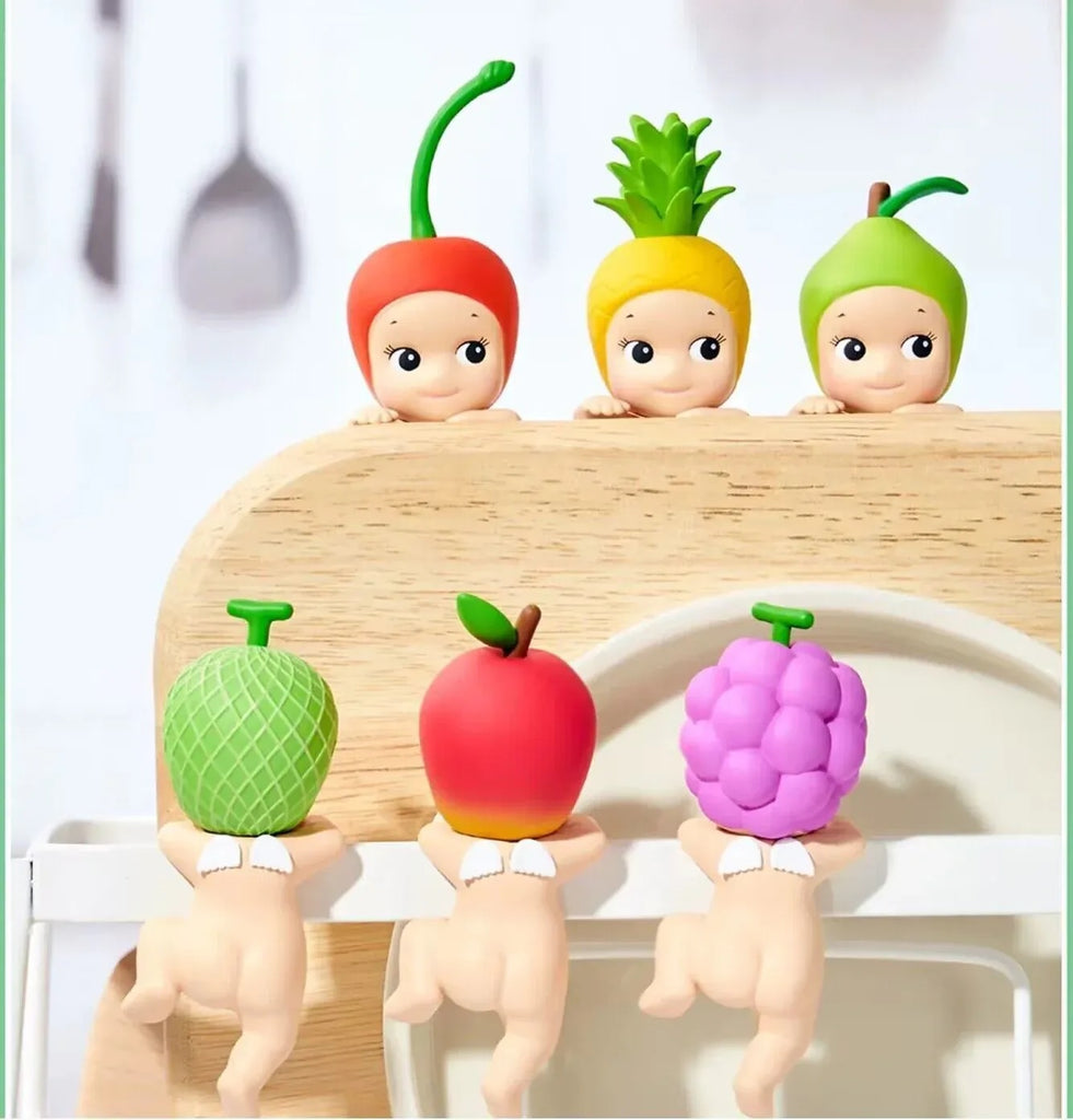 Colorful Sonny Angel Hipper Harvest Series on a wooden stand.