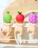 Three Sonny Angel Hipper Harvest Series on a wooden stand.