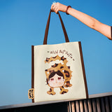 POP MART Wild but Cutie Bag with a cartoon character and 'Wild But Cutie' text against a blue sky.