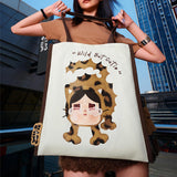 Person holding a POP MART Wild but Cutie Bag with a leopard print design and text in an urban setting