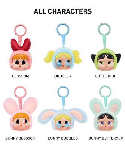 Set of colorful POP MART Cry Baby Powerpuff Girls Vinyl Plush keychains with labels on a white background