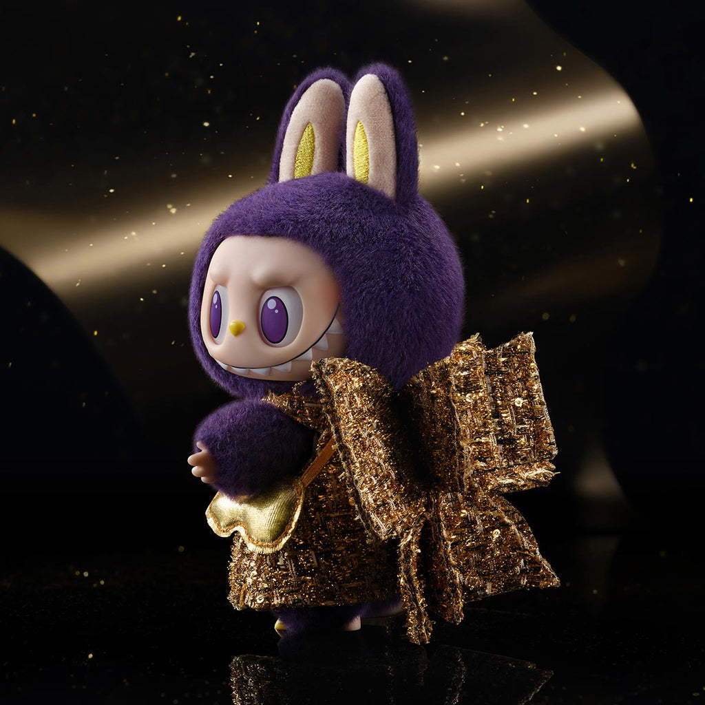 POP MART Labubu Wings of fortune with a purple hood and gold outfit against a dark background