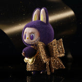 POP MART Labubu Wings of fortune with a purple hood and gold outfit against a dark background