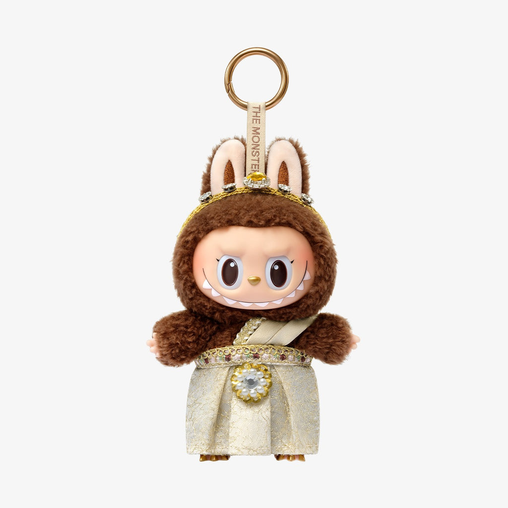 POP MART Good luck to you  keychain with a character in a brown hood and gold accents on a white background