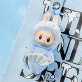 Labubu Plush toy keychain of a character in a blue outfit with a shell, attached to a strap.