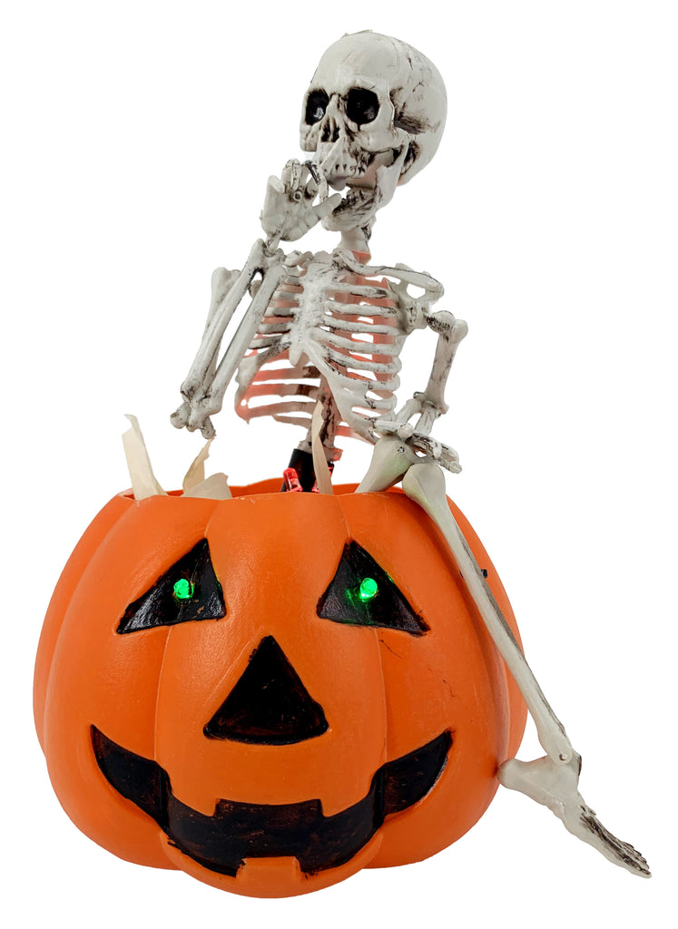 Skeleton Sitting on Pumpkin