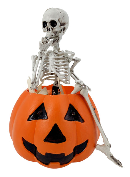 Skeleton Sitting on Pumpkin